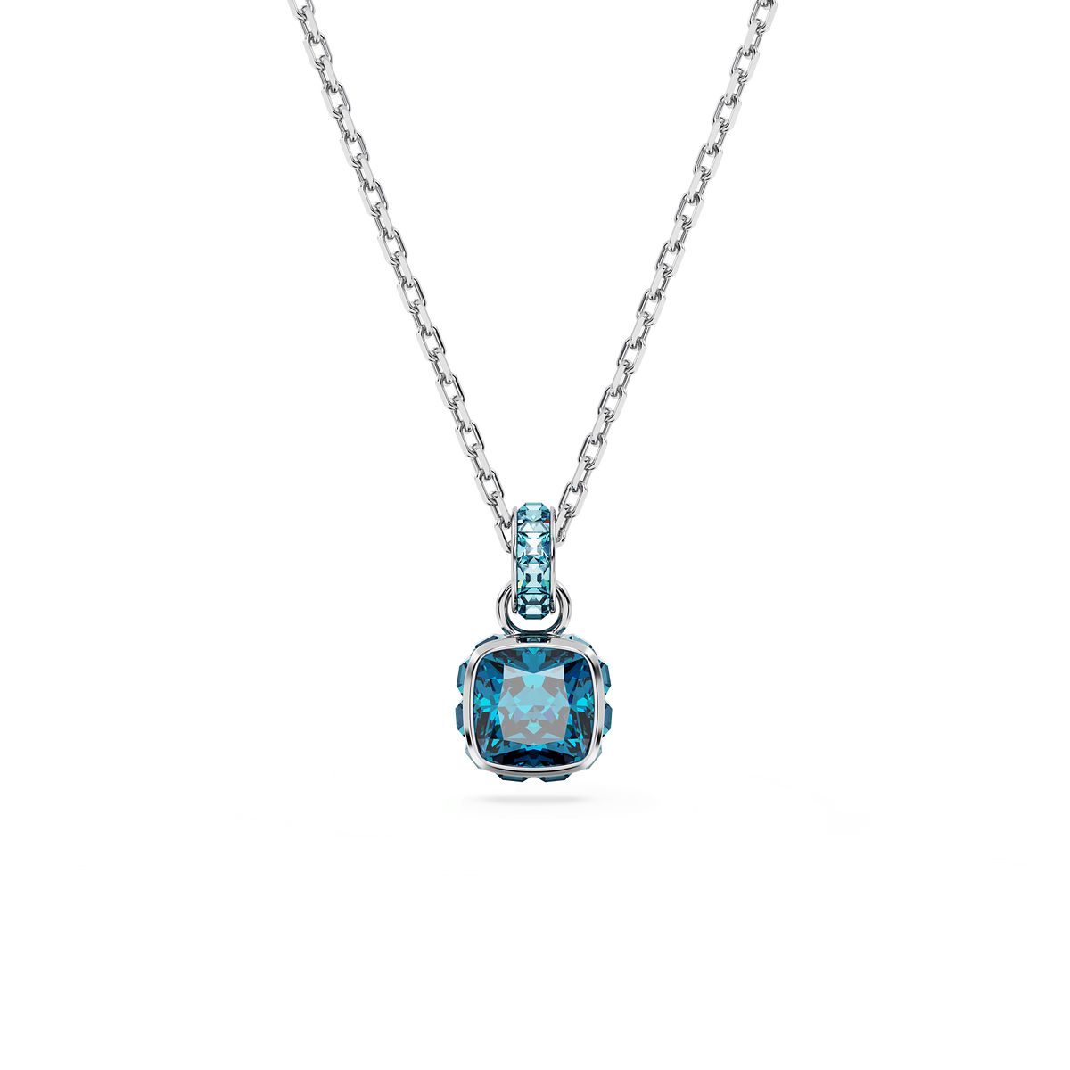 The Swarovski Birthstone Pendant features a square-cut blue gemstone for December, elegantly set in rhodium plating with an additional matching blue stone on the bail. This sparkling Swarovski pendant is presented against a white background.