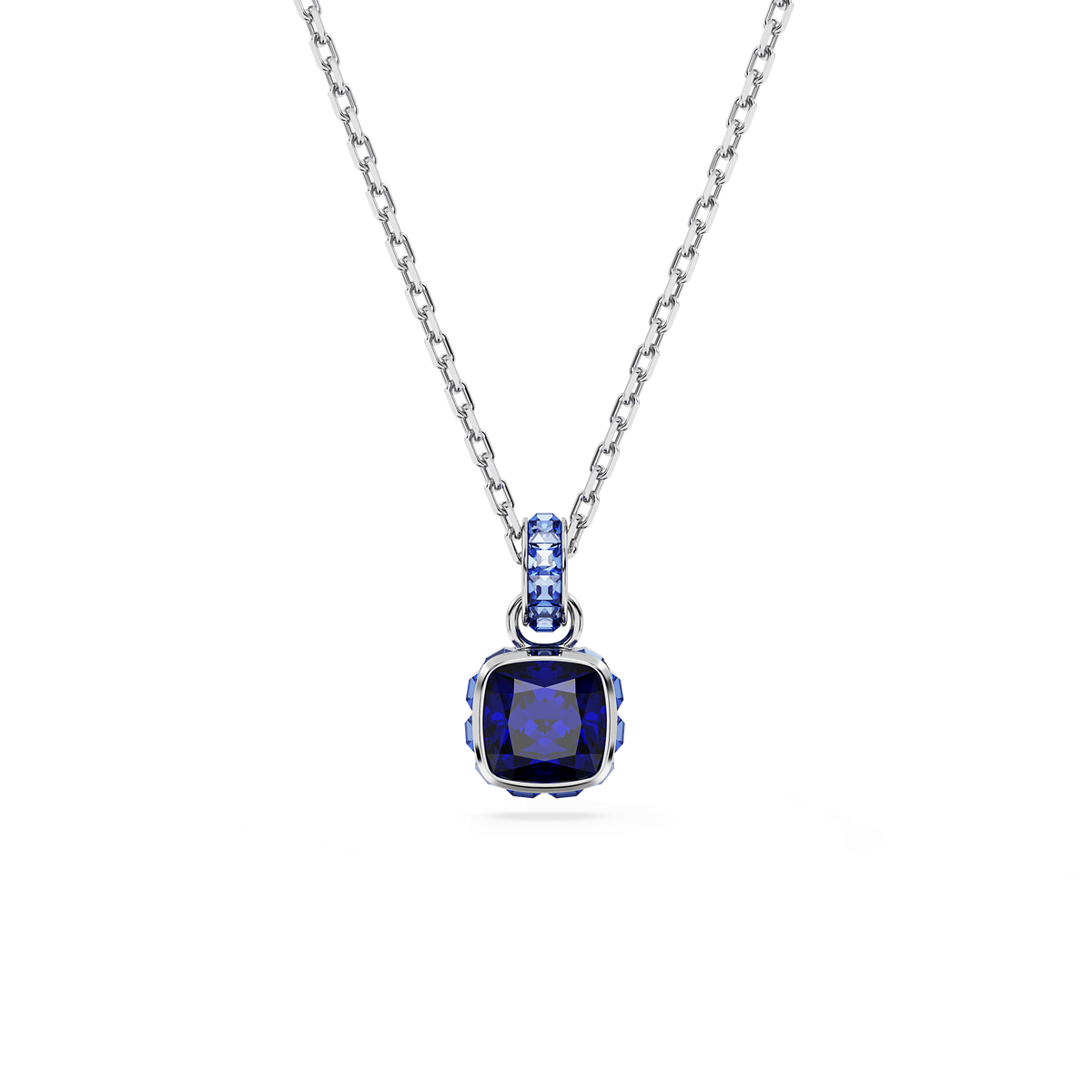 Showcase your style with the Swarovski Birthstone pendant from Raffi Jewellers. This elegant rhodium-plated necklace features a square-cut blue crystal, inspired by the September birthstone, with matching blue stones adorning the pendant’s bail. Perfectly displayed against a plain white background, this stunning Swarovski accessory is sure to impress.