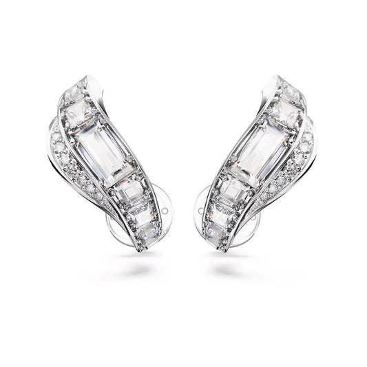 Close-up of stylish, silver-tone earrings from Swarovski, featuring the Hyperbola Clip Earrings design adorned with rectangular and round clear gemstones in a cascading wave pattern. The mixed-cut design glimmers under light, emphasizing the sophisticated and intricate details of the stones.