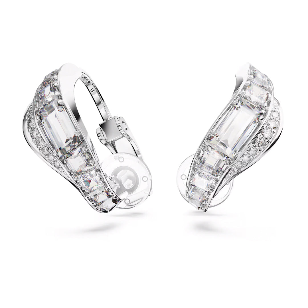 Close-up of elegant silver-tone earrings showcasing large rectangular gemstones encircled by smaller round stones. This sleek and modern mixed-cut design shines with sparkling faceted surfaces, resembling the symmetry of Swarovski Hyperbola Clip Earrings by Swarovski.
