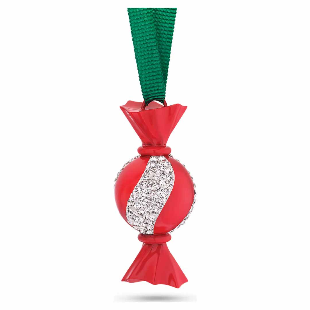 Introducing the Swarovski Holiday Cheers Dulcis Crystal Ornament, a stunning creation by Swarovski. This festive ornament is designed as a wrapped candy with a vibrant red exterior and adorned with a sparkling white swirl, accented by tiny crystals. It elegantly hangs from a green ribbon, making it the perfect piece to add charm to your holiday décor.