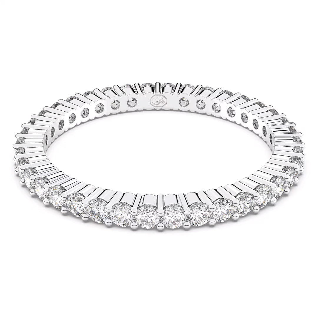 The Swarovski Vittore Ring features a continuous circle of round-cut diamonds set closely together, showcasing a silver-tone finish and prong setting that enhance the ring's elegance and brilliance.