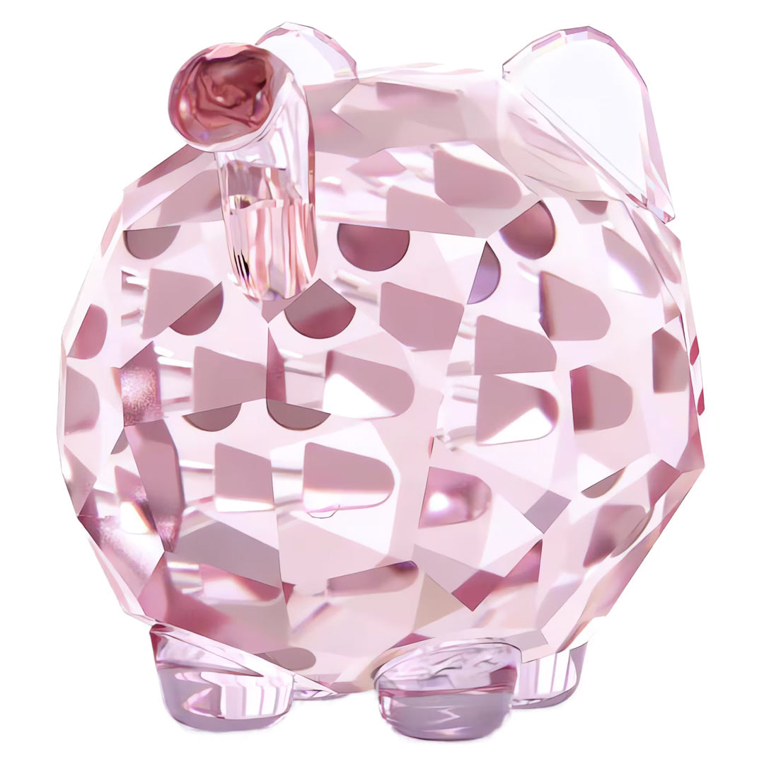 A faceted pink crystal sculpture in the likeness of a stylized cat, evocative of Swarovski’s sparkling charm, showcases geometric patterns and a glossy finish. The Swarovski Chubby Pink Cat Home Décor collectible figurine stands elegantly on a white background.