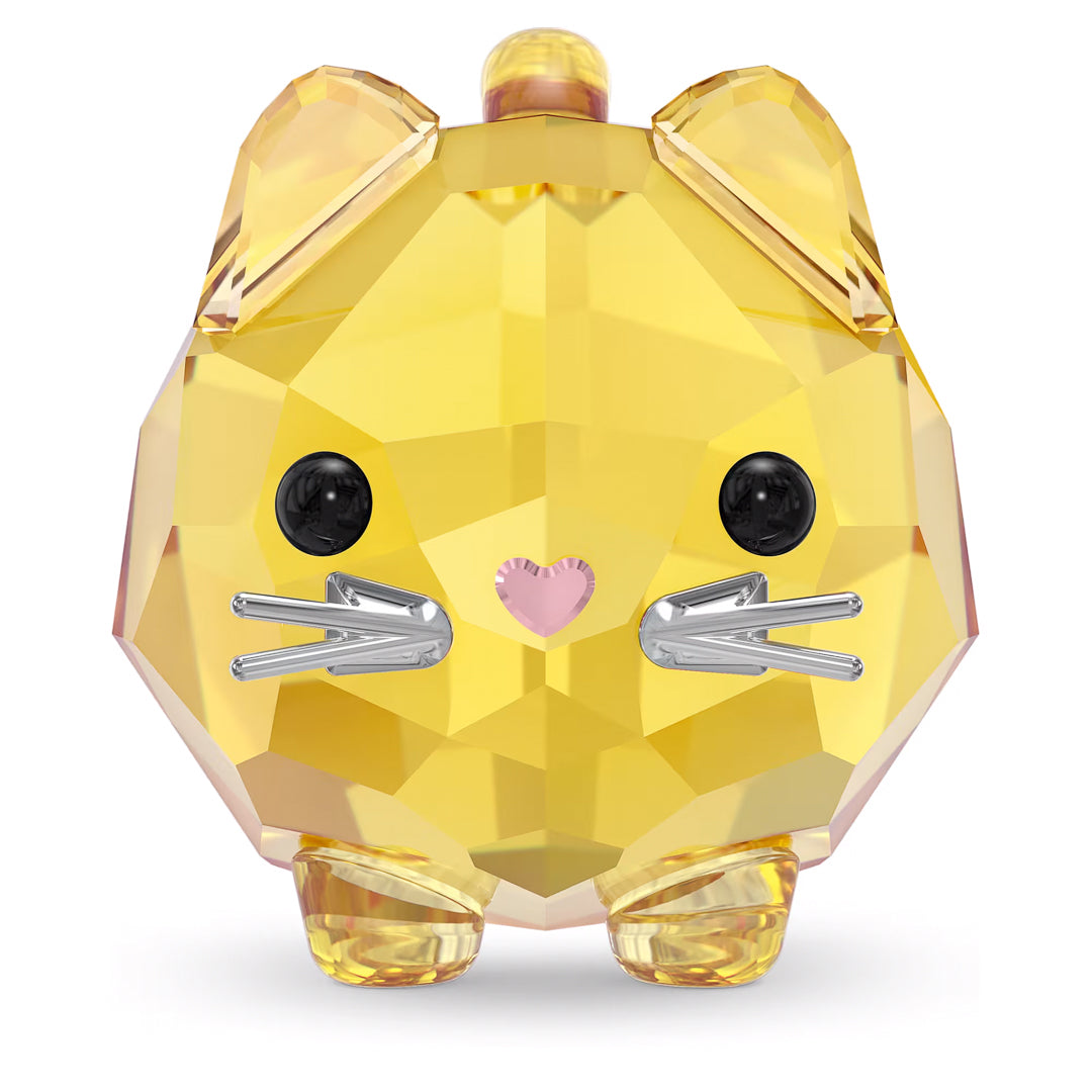 The Swarovski Chubby Yellow Cat Home Décor is a small, faceted crystal figurine shaped like a yellow cat, featuring shiny black eyes, a pink heart-shaped nose, and silver metal whiskers. Its geometric design and sparkling finish make it a delightful collectible piece for any admirer of chubby cats.