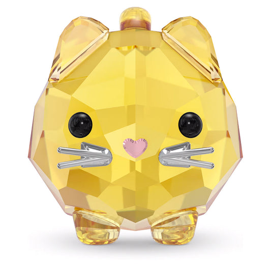 The Swarovski Chubby Yellow Cat Home Décor is a small, faceted crystal figurine shaped like a yellow cat, featuring shiny black eyes, a pink heart-shaped nose, and silver metal whiskers. Its geometric design and sparkling finish make it a delightful collectible piece for any admirer of chubby cats.