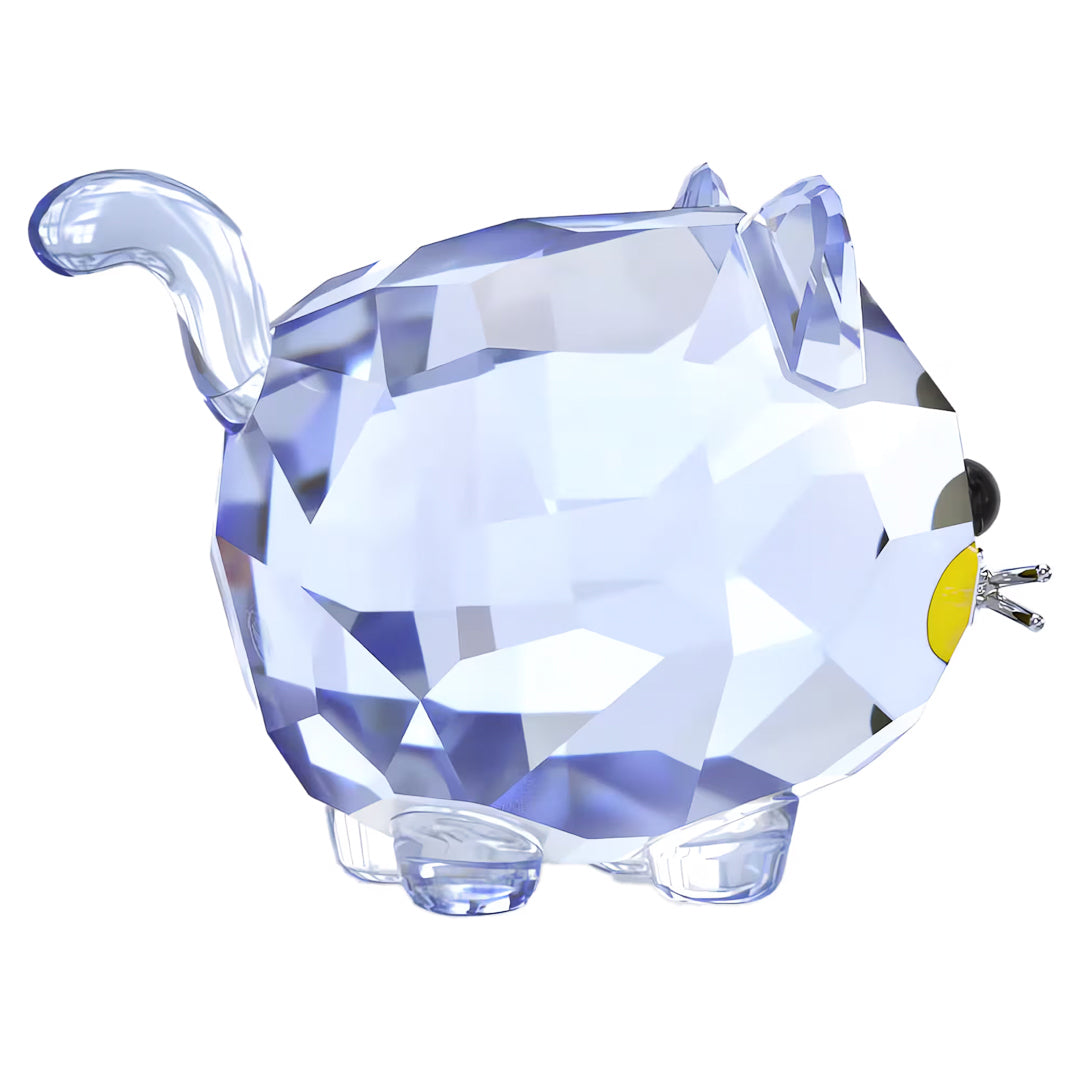 Introducing the Swarovski Chubby Blue Cat Home Décor, a stunning figurine from Swarovski. This blue-toned feline features a shiny, geometric design with a round body, upright tail, and pointy ears. It boasts a black nose and striking yellow circular eyes. A brilliant collectible piece that vividly reflects light.