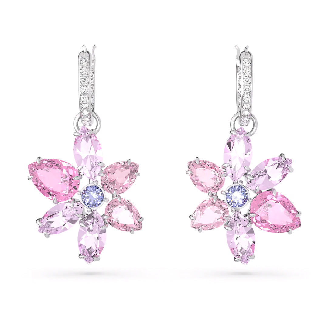 Introducing the Swarovski Gema Drop Earrings by Swarovski, a stunning pair featuring an elegant floral design with a blend of light pink, dark pink, and lavender gemstone petals. Each earring is beautifully adorned with a rhodium-plated silver hook encrusted with delicate clear stones.