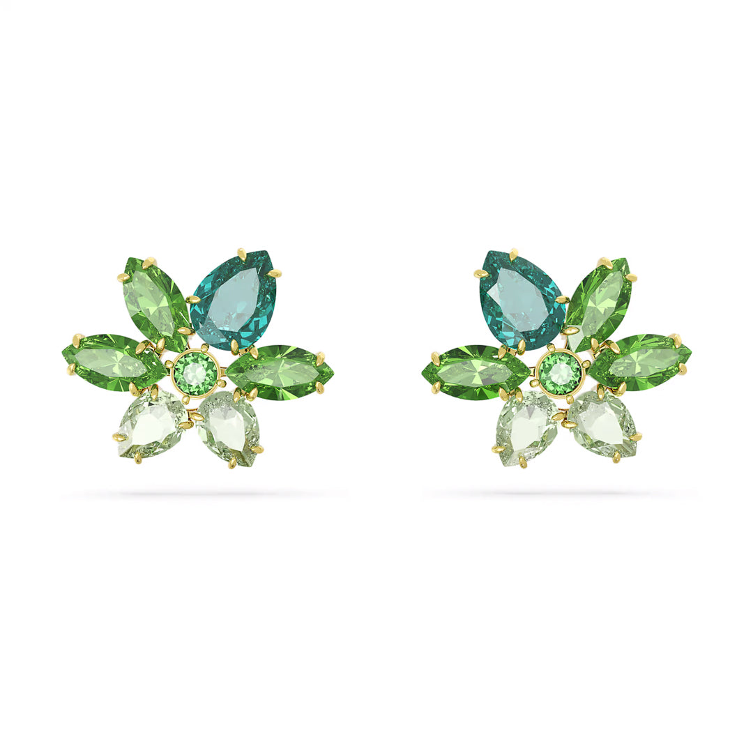 The Swarovski Gema Stud Earrings are a floral-inspired masterpiece featuring a beautiful arrangement of three green and two blue gemstones, designed to resemble delicate petals. Each earring highlights a central green crystal surrounded by expertly cut marquise and pear-shaped stones, all elegantly set in gold-tone plating by Swarovski.