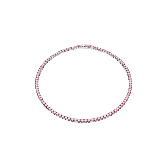 Introducing the Swarovski Small Pink Round Cut Crystal Matrix Tennis Necklace, a stunning choker featuring a continuous row of purplish pink crystals set in a rhodium-plated chain. These exquisite gems form an elegant circle, giving the piece both minimalist and sophisticated appeal.
