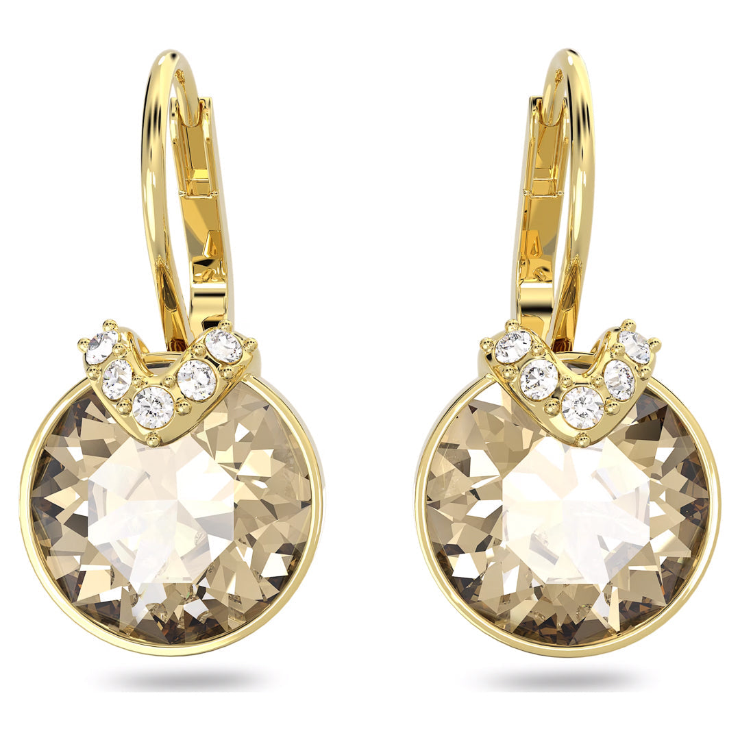 Swarovski Bella V Drop Earrings by Swarovski showcase a faceted golden center stone, beautifully enhanced by large, round crystals. Elegant smaller white gems are arranged in a decorative arch above each crystal, lending a luxurious touch to this intricate design.