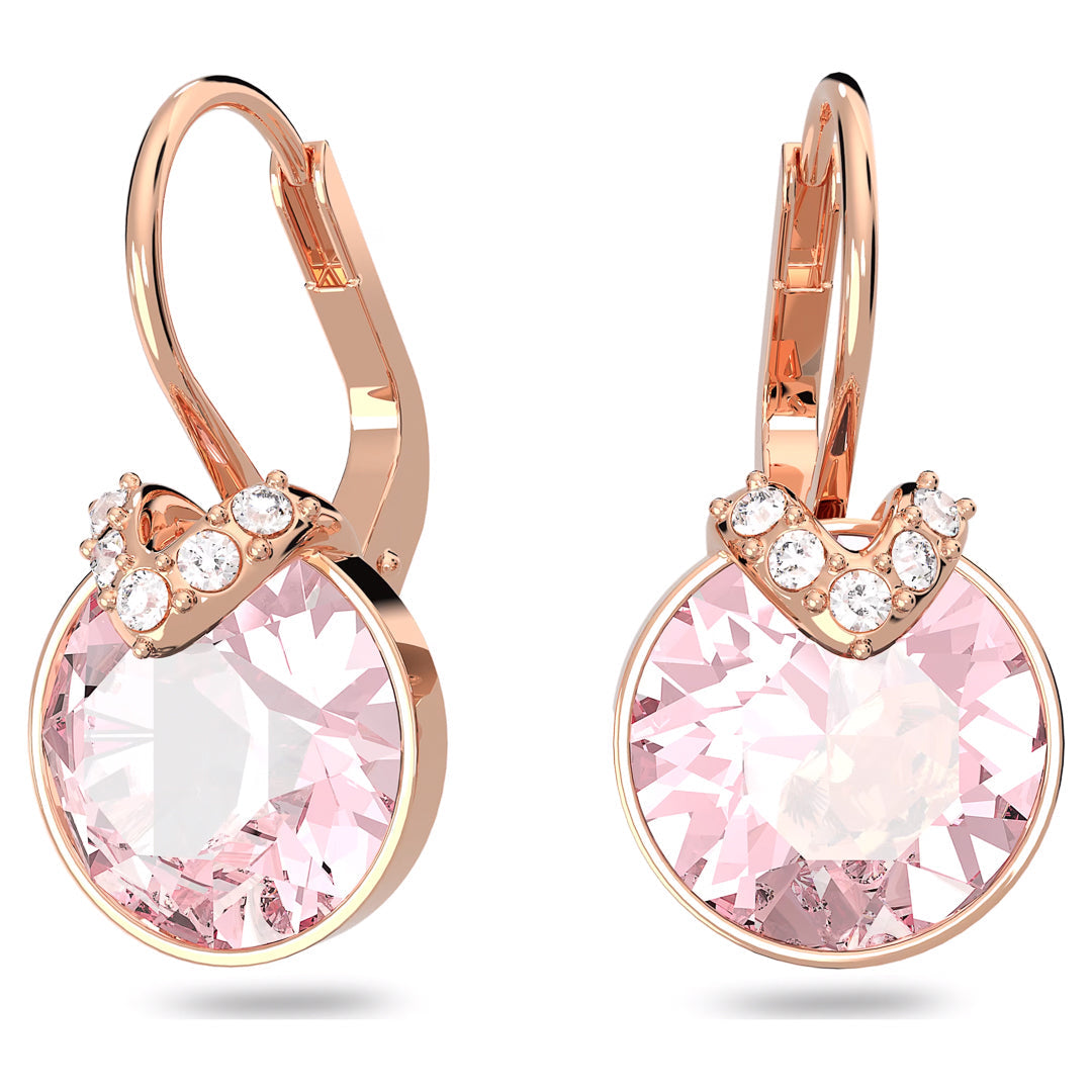The Swarovski Bella V Drop Earrings feature a rose gold-tone design adorned with round pink crystals and shimmering pavé stones at the top. These earrings boast lever-back clasps and a sleek, elegant style offered by the Swarovski brand.