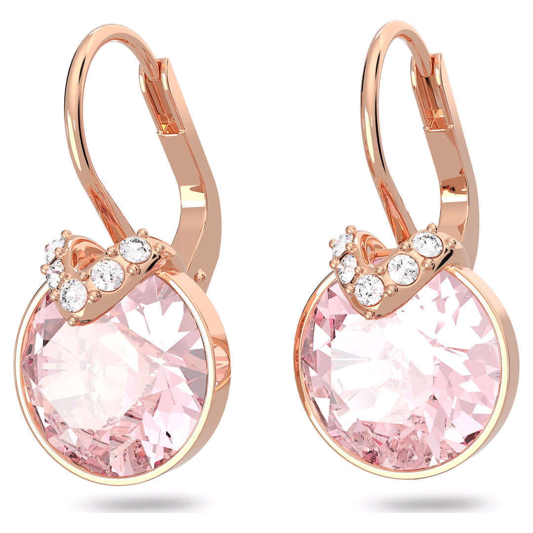 Introducing the Swarovski Bella V Drop Earrings by Swarovski: These rose gold-tone earrings feature a stunning circular pink gemstone set in a rose gold frame, accented with a sleek band of sparkling clear crystals at the top. This elegant piece of jewelry exudes sophistication and is perfect for any occasion.