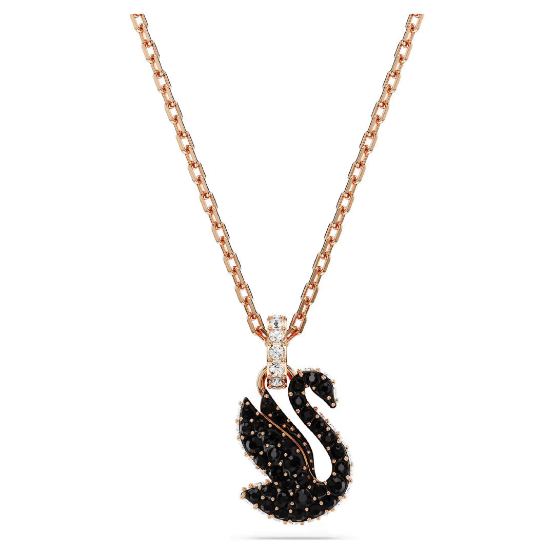 The Swarovski Swan Necklace Pendant by Swarovski showcases a gold necklace with a striking swan motif pendant, embellished with dazzling ReCreated crystals and delicate white gems, elegantly suspended from a gold chain.