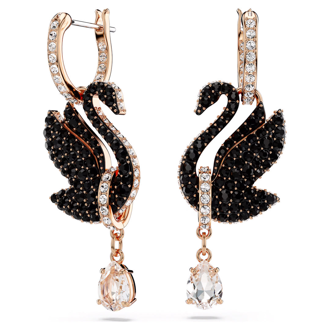 The Swarovski Swan Drop Earrings exhibit an elegant swan motif, embellished with black and white crystals. Featuring a drop design with sparkling gem pendants, these earrings display curved necks and wings for a luxurious and artistic look in a stunning rose gold-tone finish.