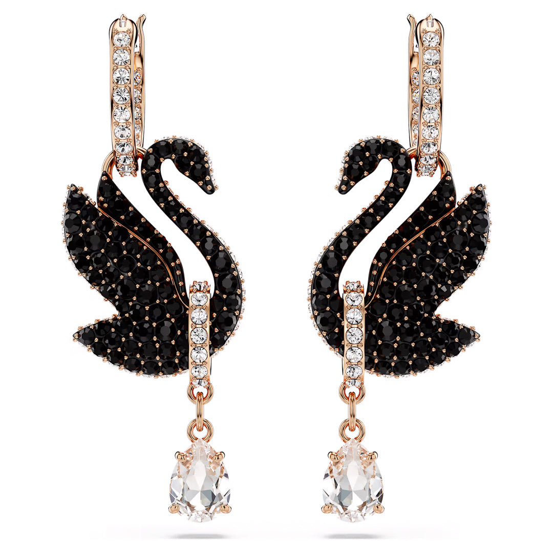A pair of Swarovski Swan Drop Earrings, crafted by Swarovski, featuring a delicate rose gold-tone and showcasing a graceful swan motif. Each earring is adorned with black stones and sparkling clear crystals that elegantly dangle at the bottom.
