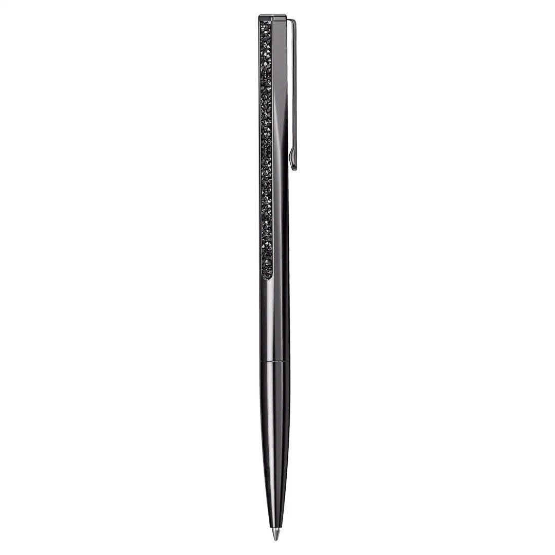 The Swarovski Crystal Shimmer Ballpoint Pen by Swarovski features a sleek black design with an ultra-fine tip and a shiny finish, highlighted by a decorative textured strip on the clip that evokes the sparkle of Swarovski stores, set against a pristine white background.
