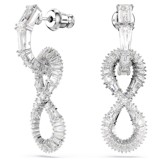 Presenting the Swarovski Hyperbola Drop Earrings by Swarovski, featuring an elegant figure-eight design adorned with clear, sparkling gemstones. Rhodium-plated for enhanced brilliance, these earrings showcase a circular top part that connects to a post stud, while the loops are formed by tapering baguette-cut stones. The result is a luxurious and intricate appearance.