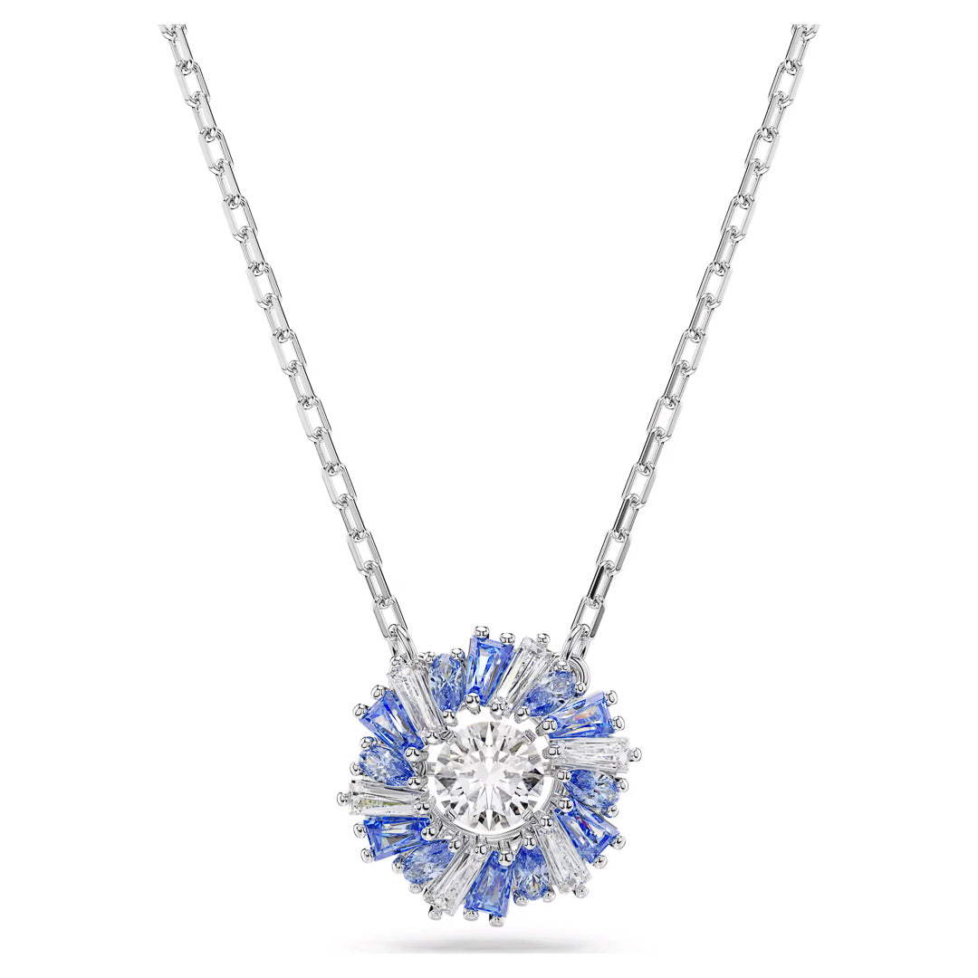 Explore the sophistication of the Swarovski Idyllia Necklace Pendant, crafted by Swarovski. This exquisite silver necklace boasts a rhodium-plated finish and features a central round diamond encircled by small purple gemstones in a radiant sunburst pattern.