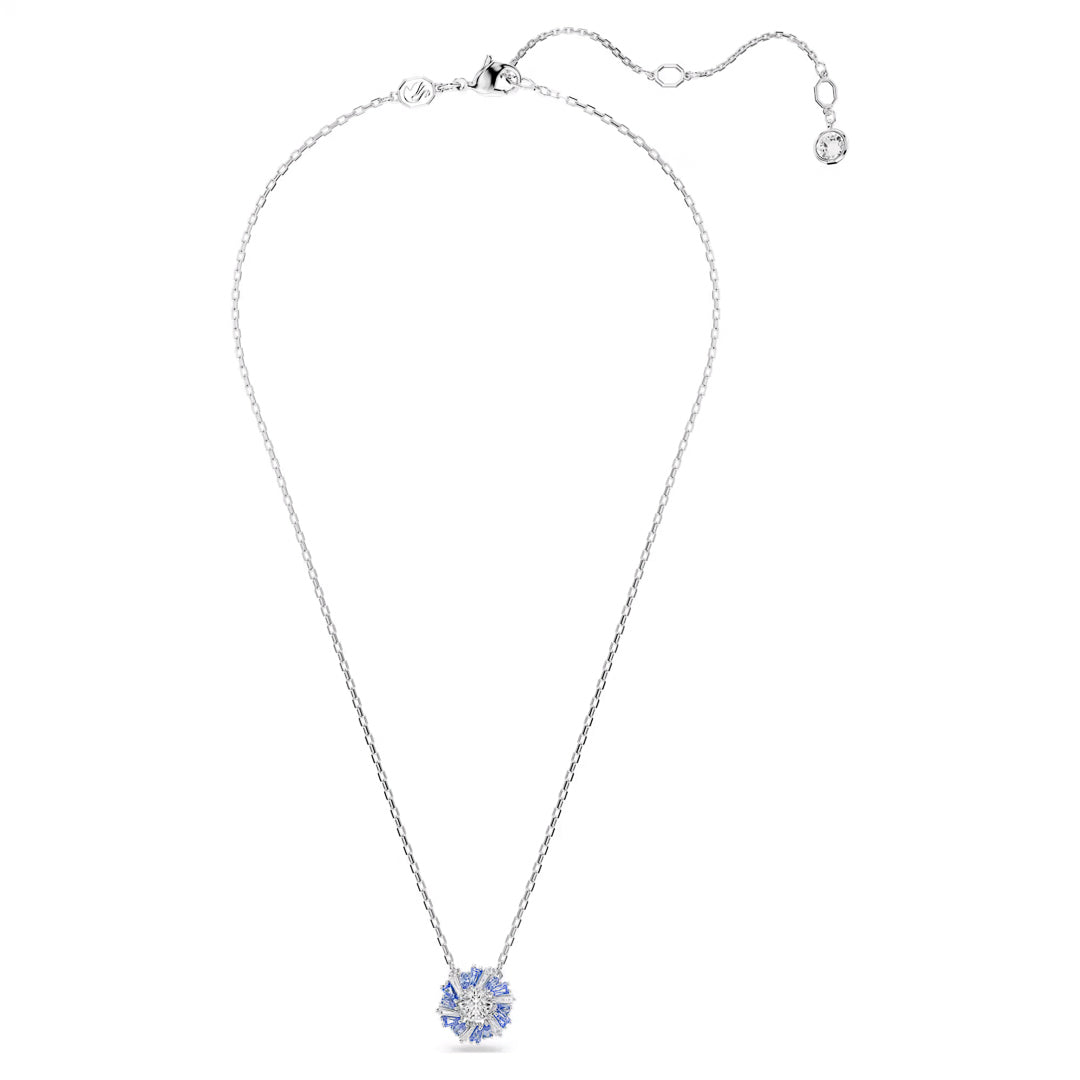 This Swarovski Idyllia Necklace Pendant by Swarovski showcases a delicate rhodium-plated silver chain and a snowflake-shaped pendant, adorned with light blue Swarovski Zirconia. The adjustable chain is elegantly finished with a small round charm at the clasp for added sophistication.