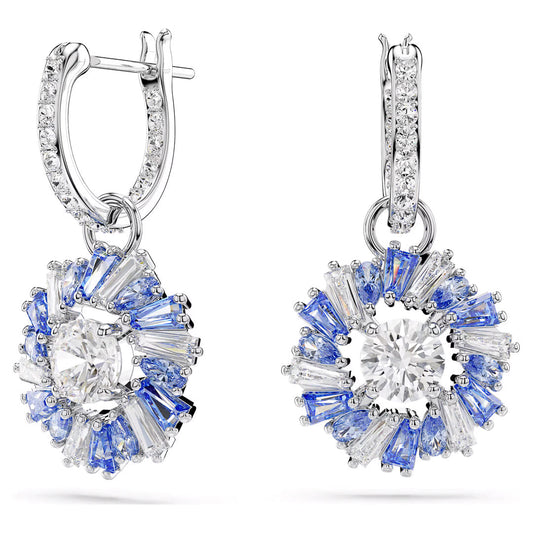 These exquisite Swarovski Idyllia Drop Earrings showcase large central clear stones, beautifully surrounded by alternating blue and clear baguette-shaped Swarovski Zirconia gems, set in a radiant metal. The hoops are adorned with small sparkling stones for an elegant finish.