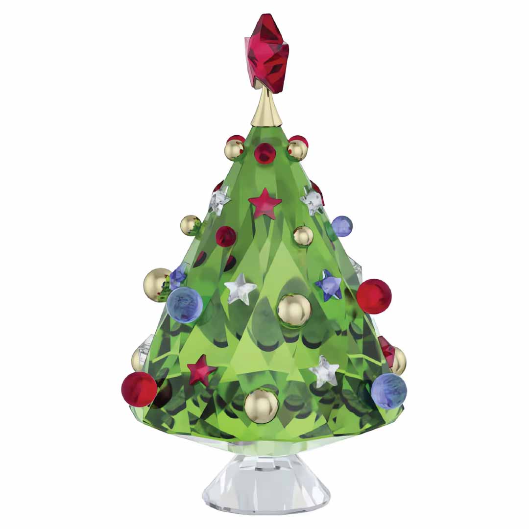The Swarovski Holiday Cheers Tree Home Décor by Swarovski, featuring a decorative design with green crystals adorned with red stars, blue and gold round ornaments, and topped with a faceted red star on a clear base, makes for the perfect festive centerpiece.
