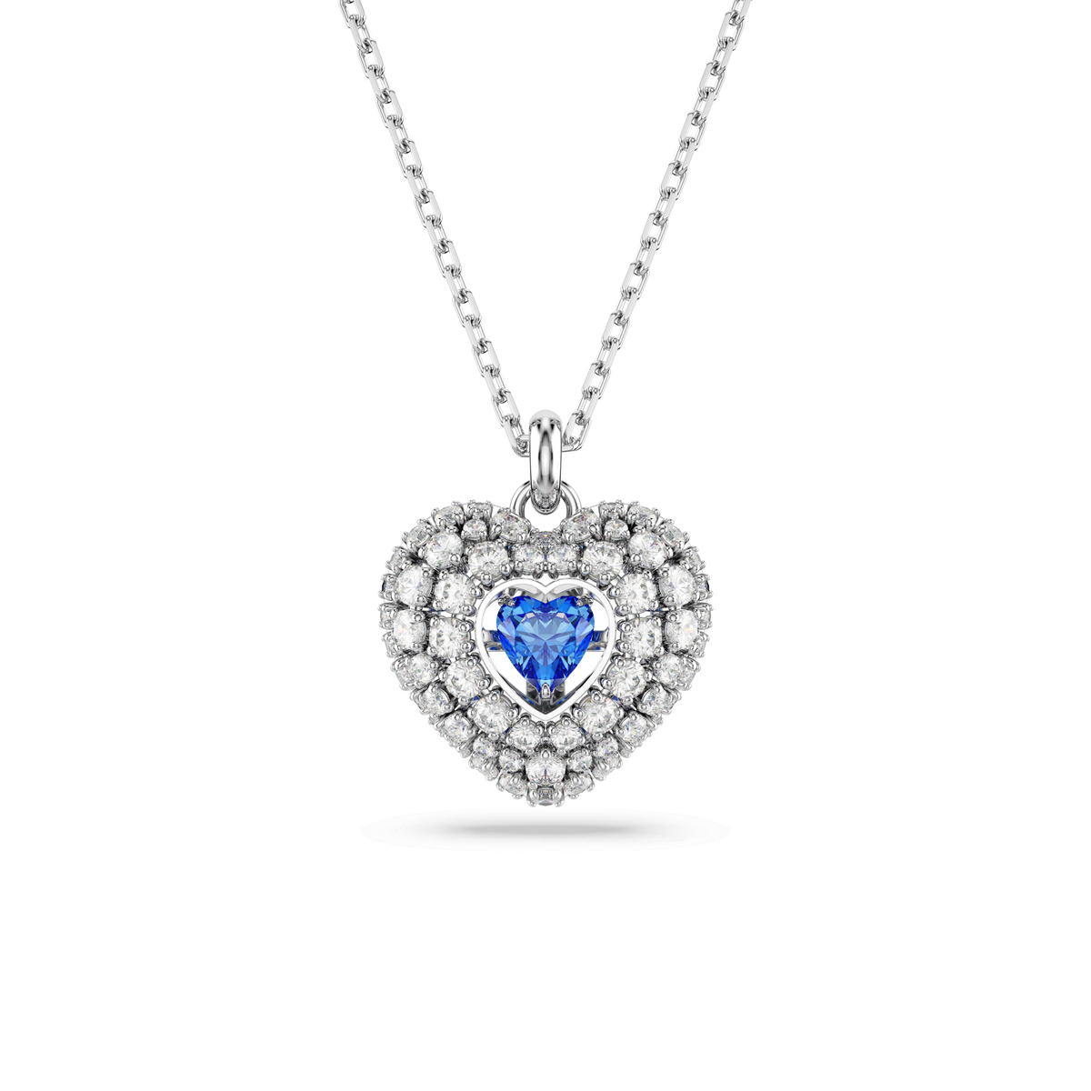 Introducing the Swarovski Hyperbola Pendant in Heart Blue, a stunning silver necklace by Swarovski. This elegant piece features a heart-shaped pendant adorned with a dazzling blue gemstone at its center, encircled by two rows of sparkling clear crystals, and finished with a luminous rhodium-plated shine. Inspired by timeless sophistication, the pendant is beautifully showcased against a white background.