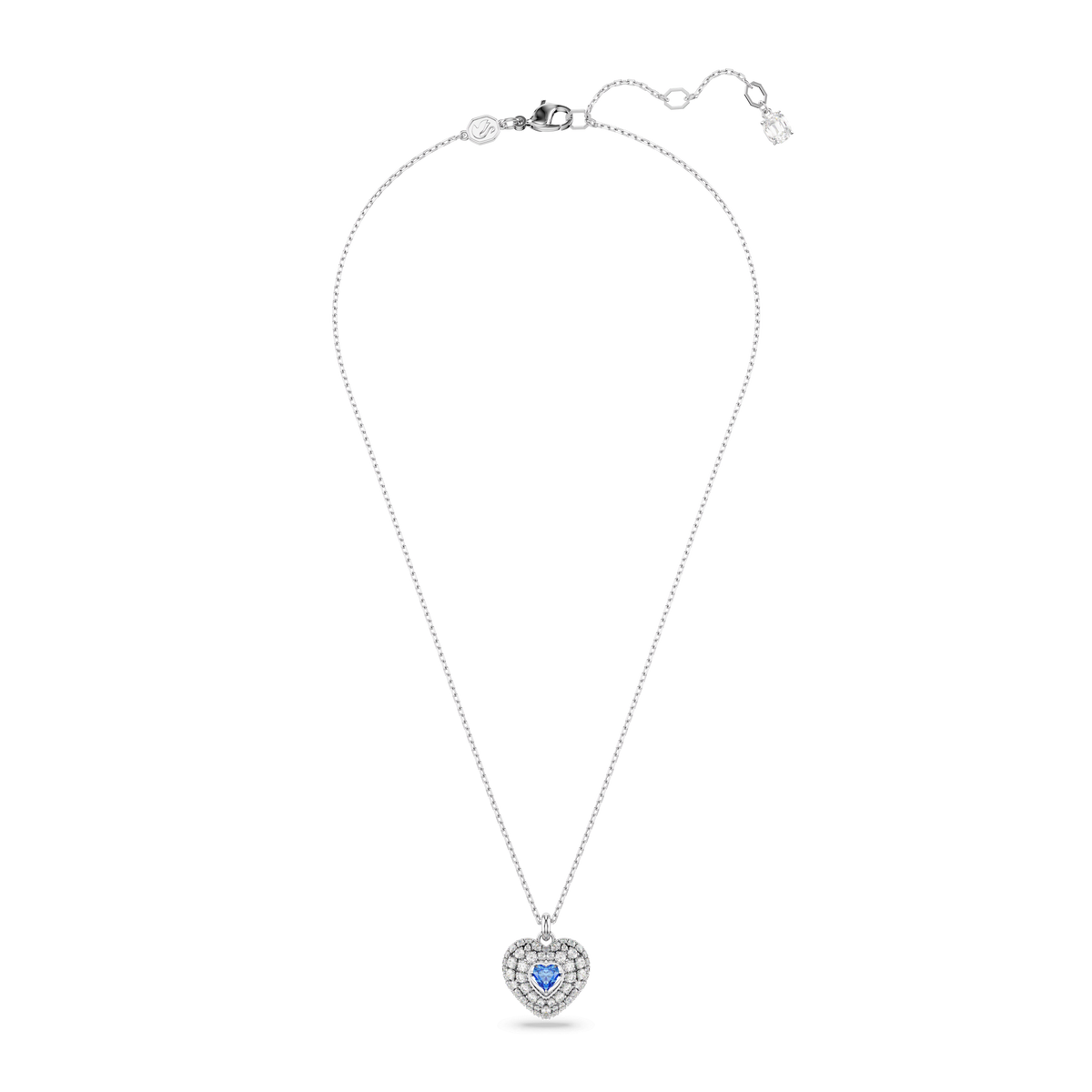 The Swarovski Hyperbola Pendant is a delicate rhodium-plated silver necklace featuring a heart-shaped Heart Blue centerpiece surrounded by sparkling clear stones, elegantly displayed on a white background.