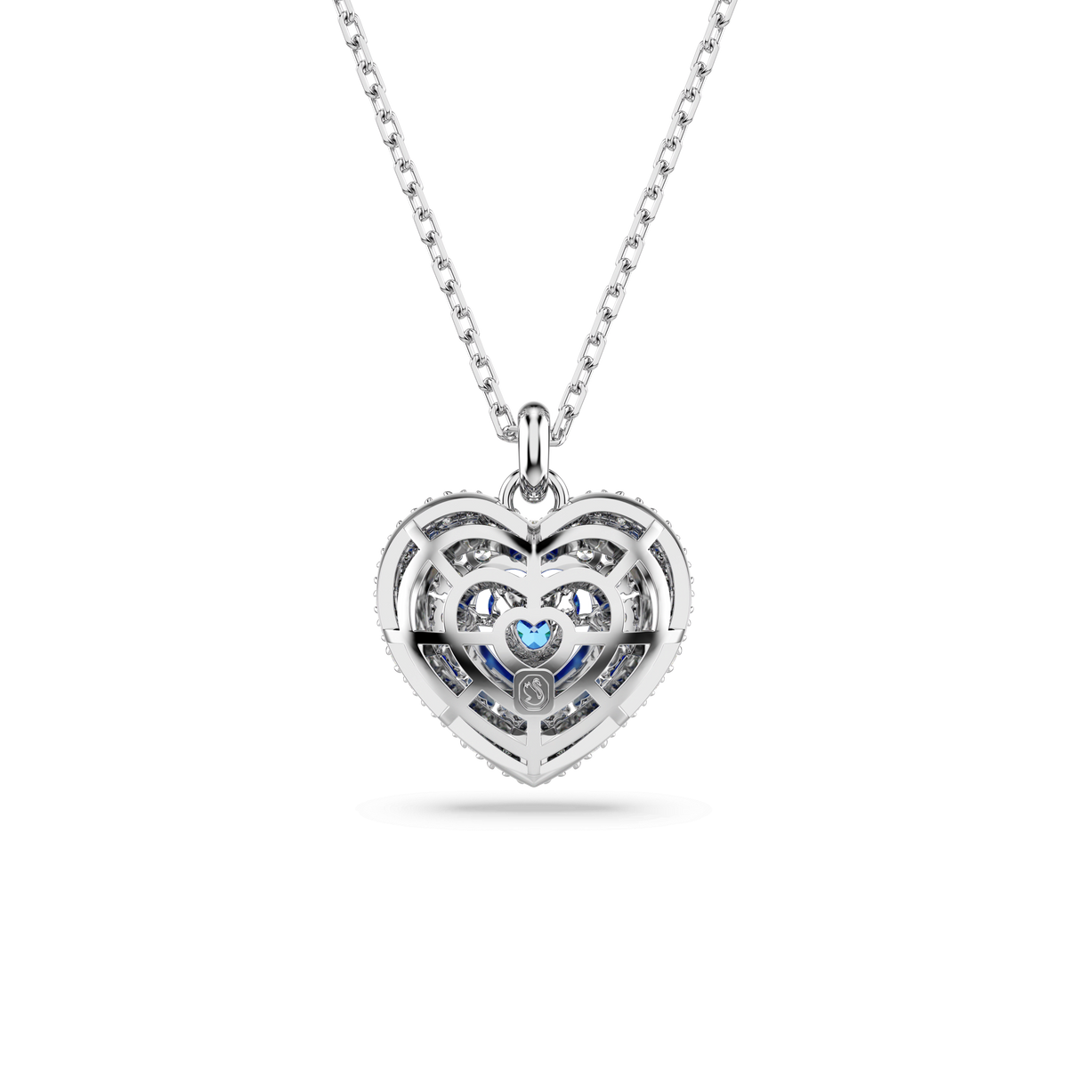 A rhodium plated silver necklace by Swarovski, featuring the Hyperbola Pendant with a heart-shaped design in blue, adorned with intricate openwork and sparkling stones at the center.