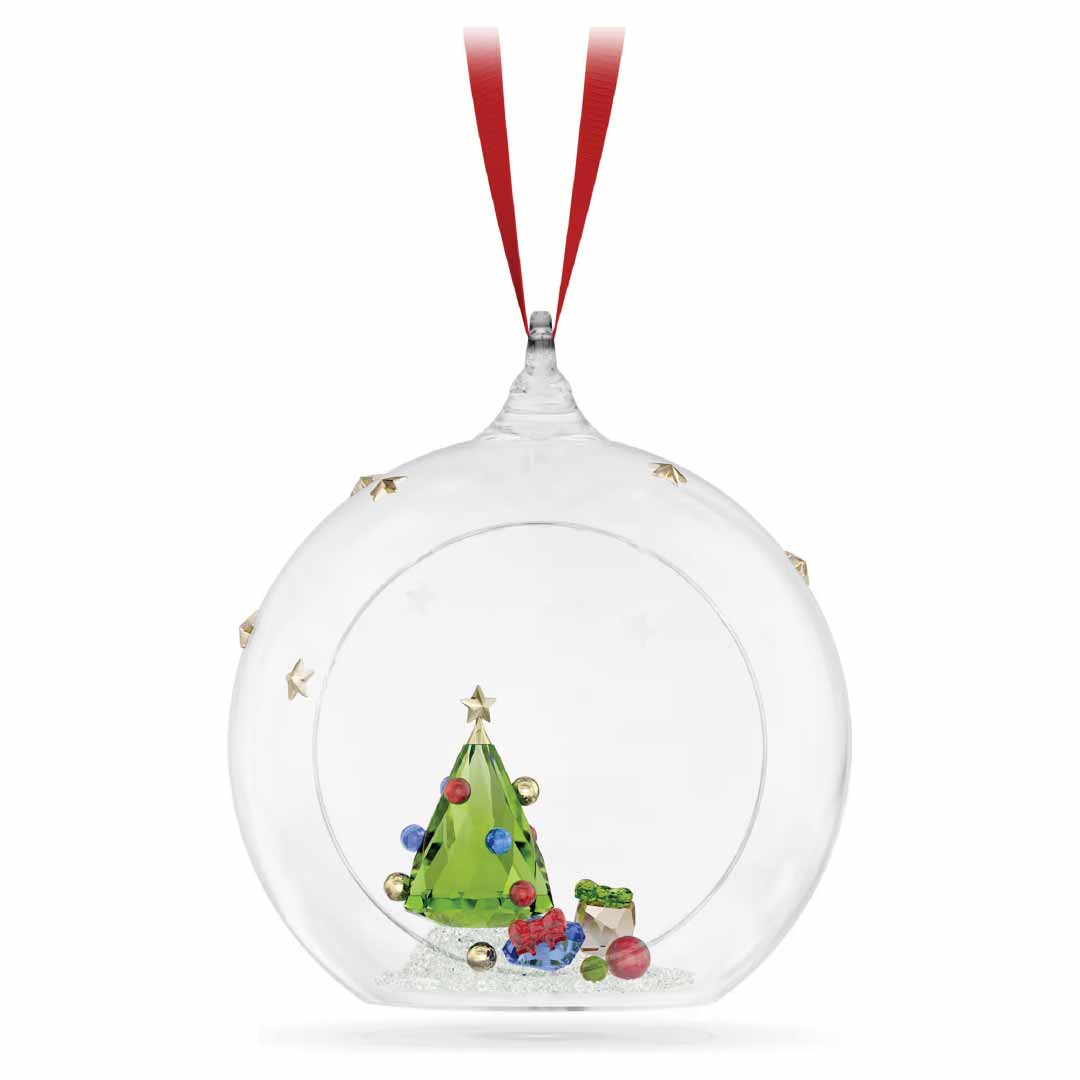 The Swarovski Holiday Cheers Tree and Gifts Ball Ornament Home Décor, by renowned brand Swarovski, features a clear, round design with a red ribbon. Inside, you’ll find a miniature green Christmas tree adorned with small, colorful baubles and surrounded by tiny wrapped gifts. Golden star accents embellish the outer shell to enhance this festive decoration's charm.