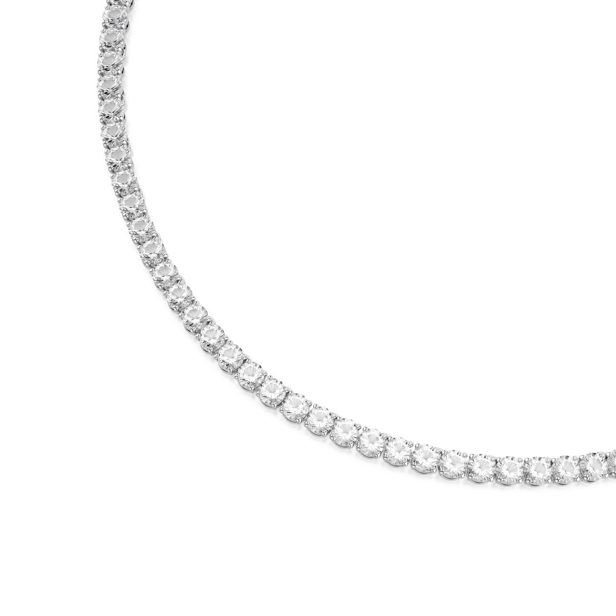 Partial view of the Swarovski Matrix Tennis necklace, featuring round-cut white stones set closely together and beautifully enhanced by a lustrous rhodium plated finish on a white background.