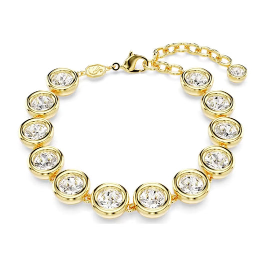 The Swarovski Imber Bracelet features round-cut crystals arranged in circular formations along its length. This piece is gold-tone plated and includes a lobster clasp along with an adjustable chain for customizable sizing.