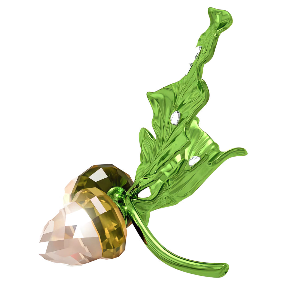 As part of the Swarovski Idyllia collection, the Swarovski Idyllia Acorns Home Décor sculpture highlights a crystal acorn with a faceted design, complemented by vibrant green, translucent oak leaves. This artistically crafted piece beautifully showcases nature-inspired elements in an exquisite seasonal creation.