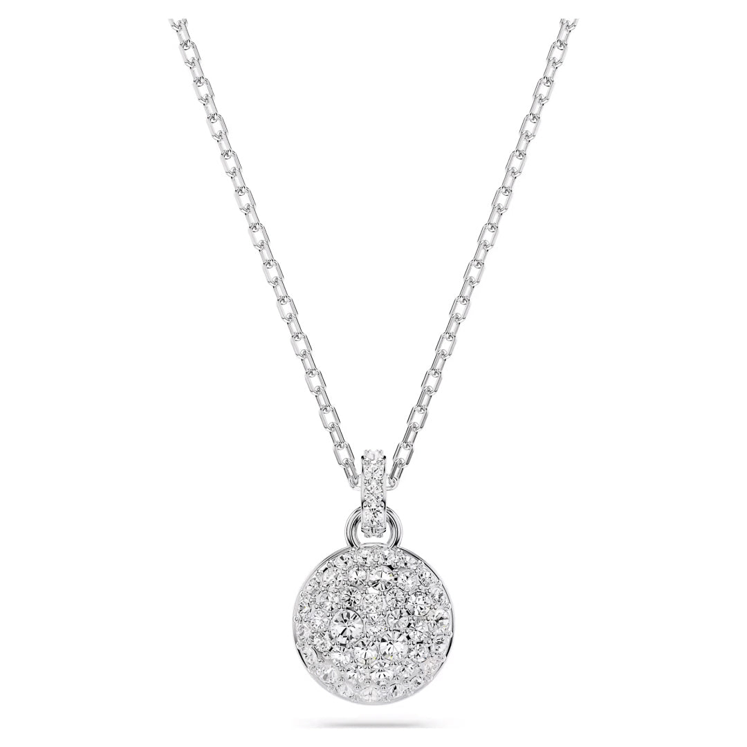 The Swarovski Sublima Necklace Pendant features a rhodium-plated silver chain and a galaxy-inspired pendant adorned with clear round crystals, exhibited elegantly against a white background. The delicate chain from Swarovski perfectly enhances the necklace's shimmering design.