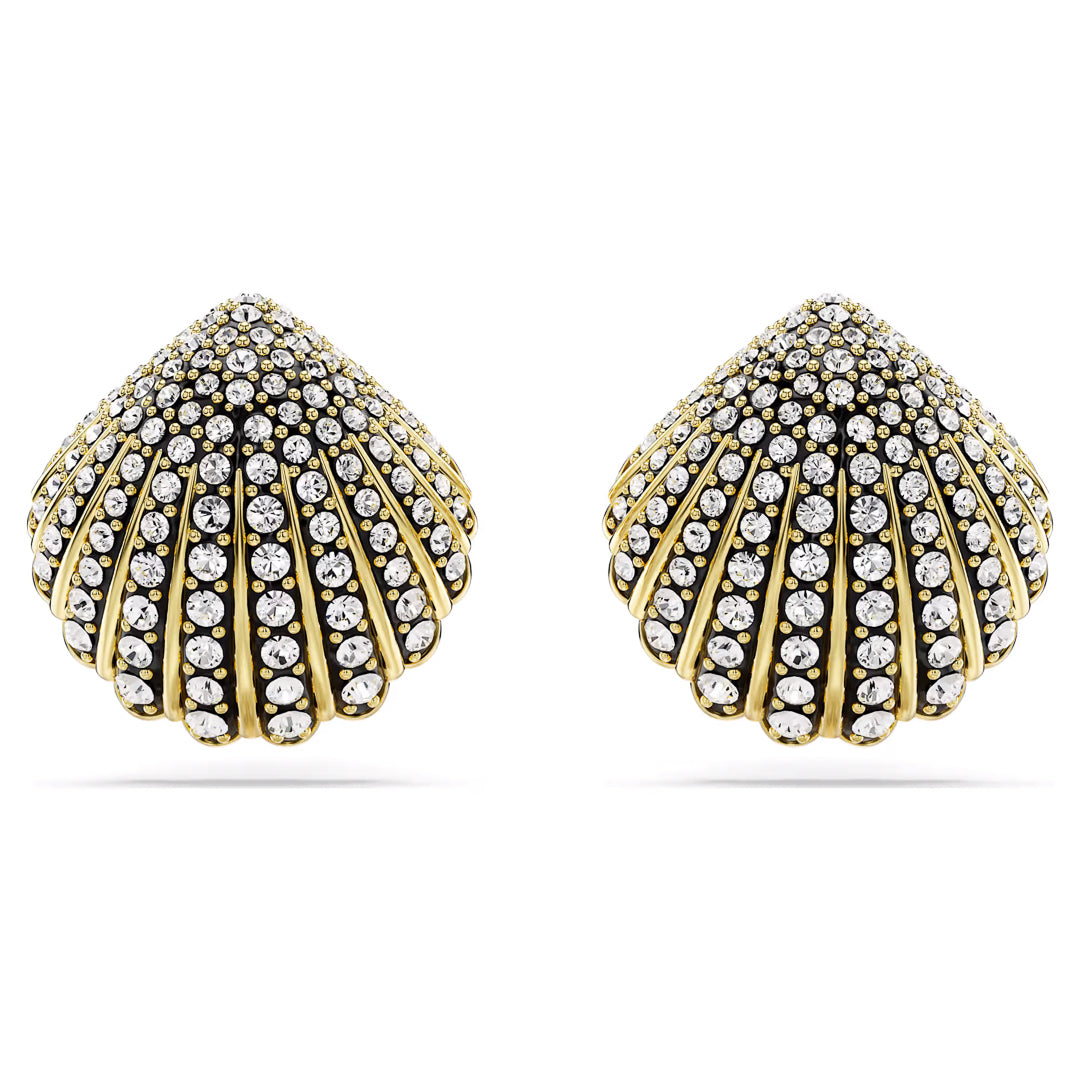 Close-up of two gold earrings featuring a shell motif, identified as the Swarovski Idyllia Stud Earrings. These exquisite accessories are embellished with rows of sparkling rhinestones and crystals, their detailed, textured appearance highlighting the intricate design against a white background to emphasize elegance.