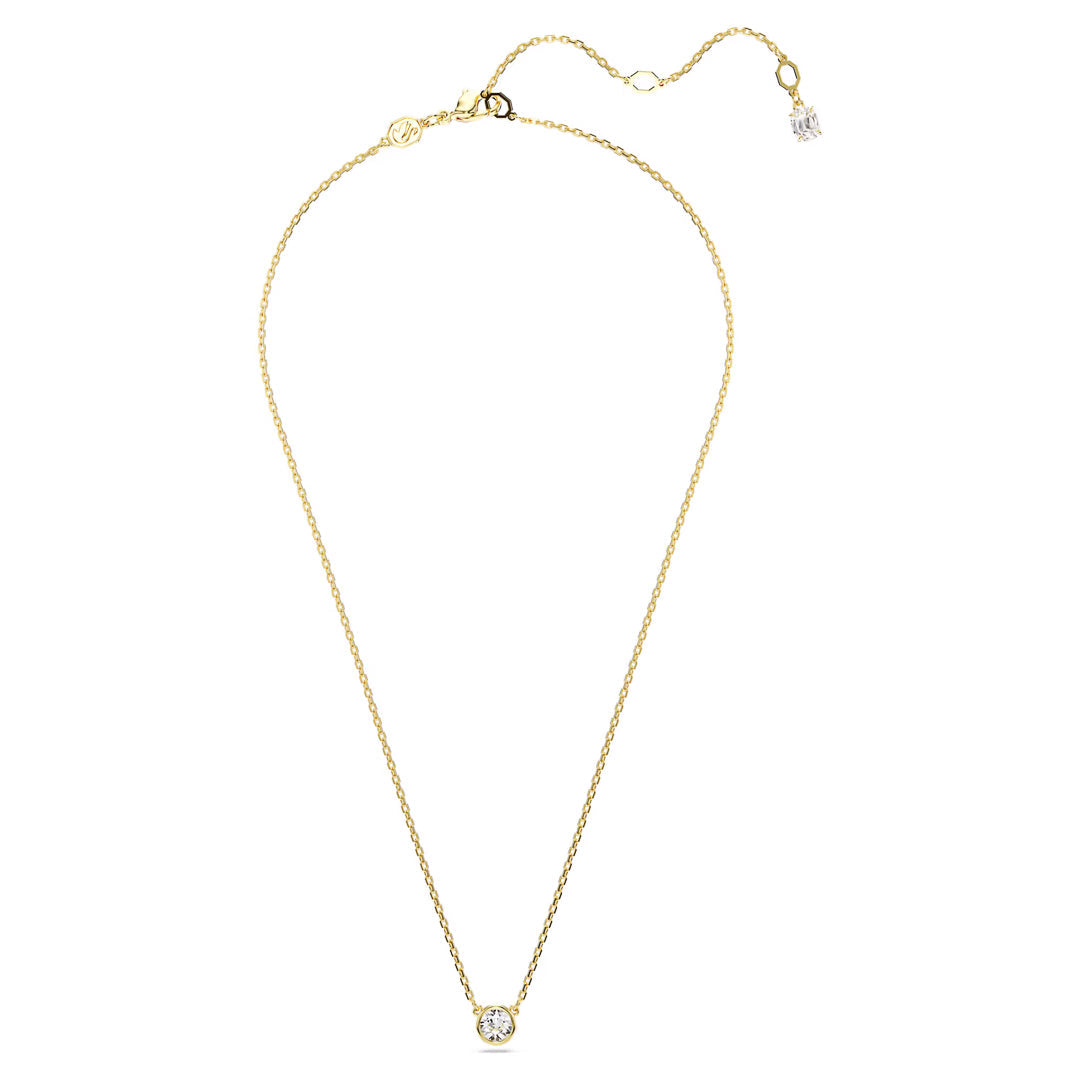 The Swarovski Imber Necklace Pendant, designed by Swarovski, features a delicate gold-tone plated chain and an Imber pendant adorned with a single round Swarovski Zirconia. The adjustable chain includes a small extension and clasp, allowing the pendant to elegantly hang at the center, highlighting its sparkling clear gemstone.