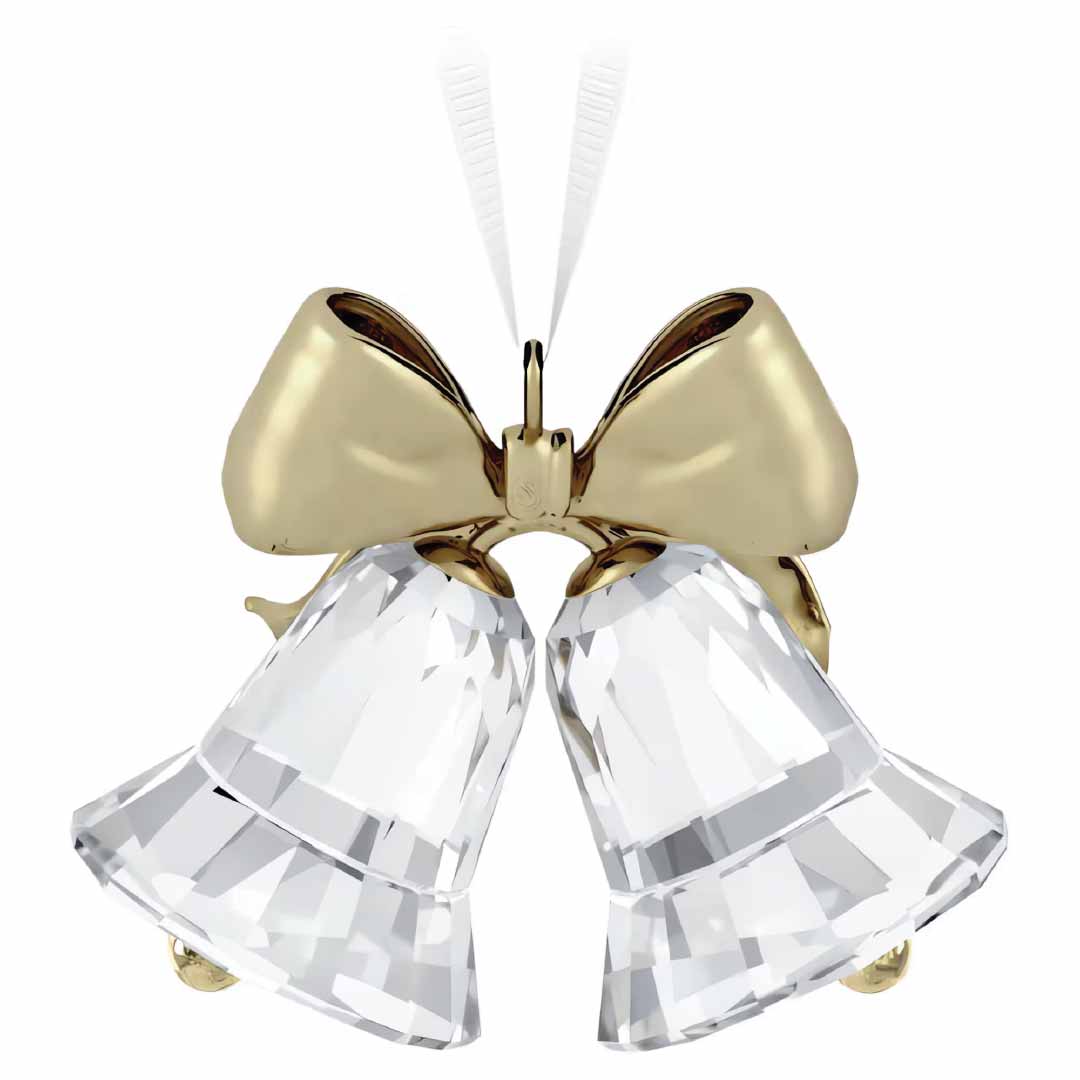 The Swarovski Holiday Magic Bells Ornament from Swarovski features a pair of translucent glass bells adorned with a large champagne gold-tone metal ribbon. Their delicate curves catch and reflect light beautifully, creating a sparkling effect as they hang elegantly together.