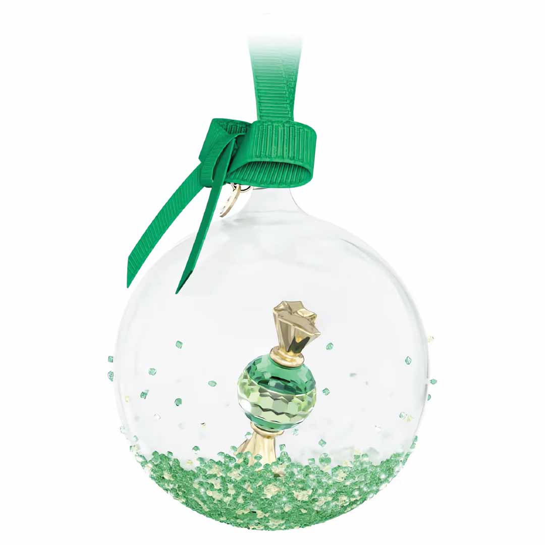 The Swarovski Holiday Cheers Dulcis Ball Ornament Home Décor features a clear glass design with a green ribbon, highlighted by a central crystal motif. It's elegantly adorned with crystal rocks and finished with green crystal beads at the base.