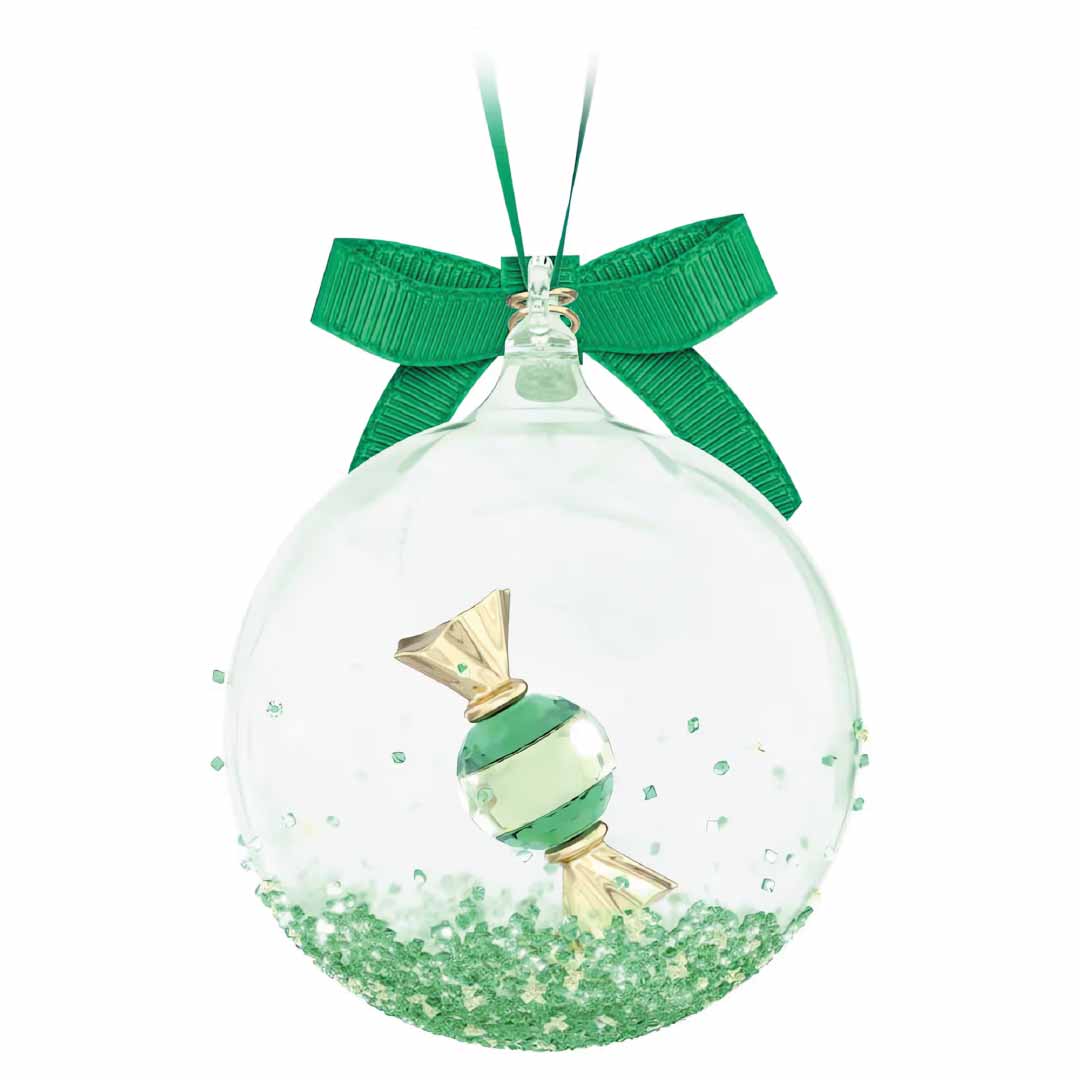 The Swarosvki Holiday Cheers Dulcis Ball Ornament Home Décor by Swarovski is a clear Christmas ornament that showcases a green striped candy inside. The bottom of the ornament is adorned with sparkling crystal rocks and green glitter, and it is topped with a luxurious green ribbon for hanging.
