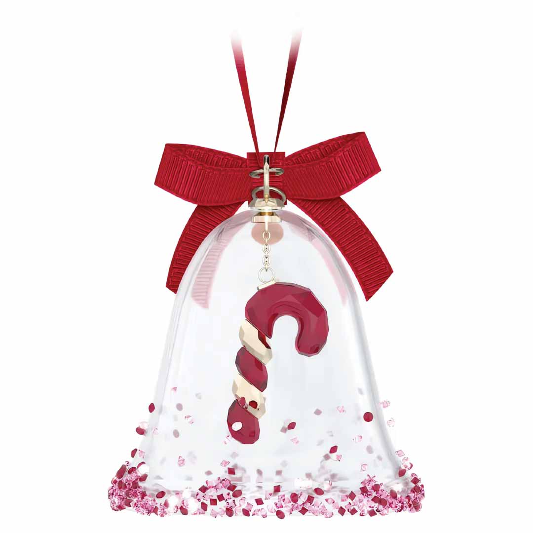 The Swarovski Holiday Cheers Dulcis Bell Ornament by Swarovski, ideal for holiday décor, showcases a candy cane inside adorned with a red bow. The red and white candy cane is exquisitely detailed with crystal-like accents around the base.