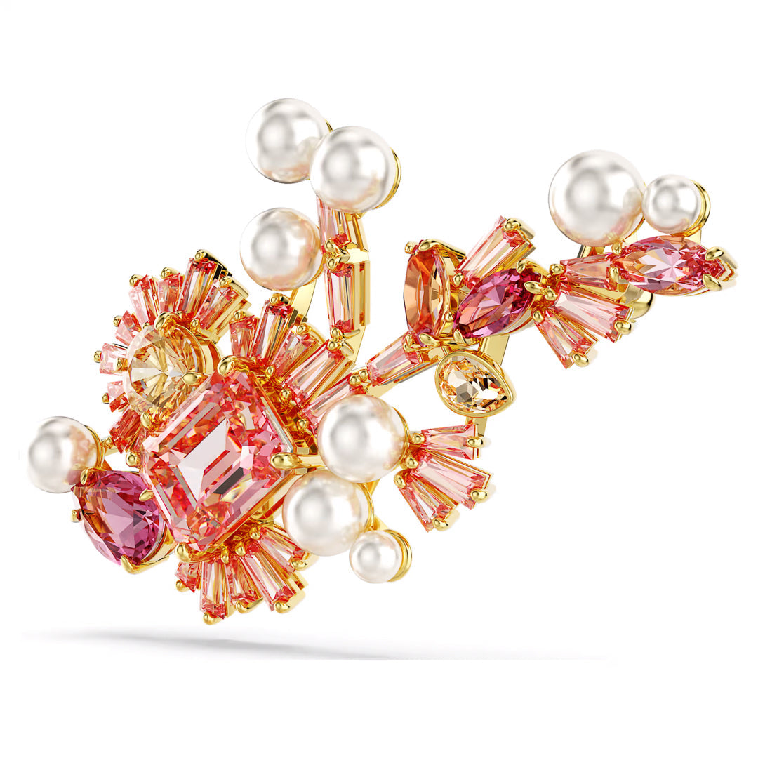 Experience the elegance of the Swarovski Gema Brooch, a luxurious gold-toned piece by Swarovski featuring pink Swarovski Zirconia and white Crystal Pearls, all arranged in an intricate floral-inspired design.