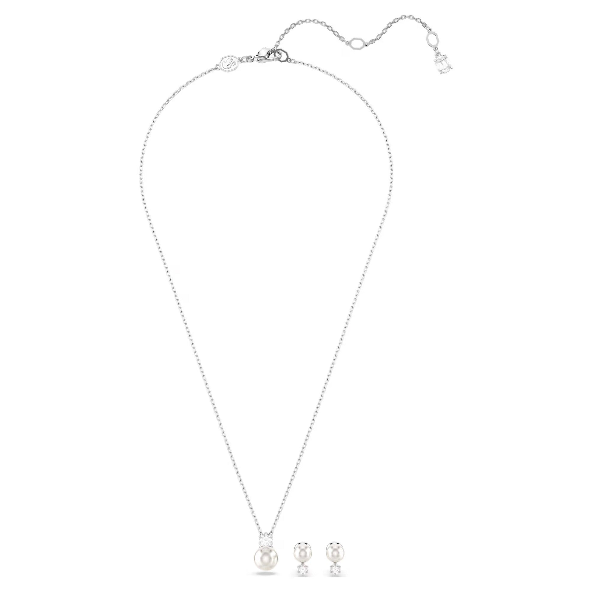The Swarovski Matrix Earrings and Necklace Set by Swarovski includes a delicate necklace featuring a single Swarovski Crystal Pearl pendant and matching pearl stud earrings. All pieces are exquisitely rhodium plated and displayed on a white background.