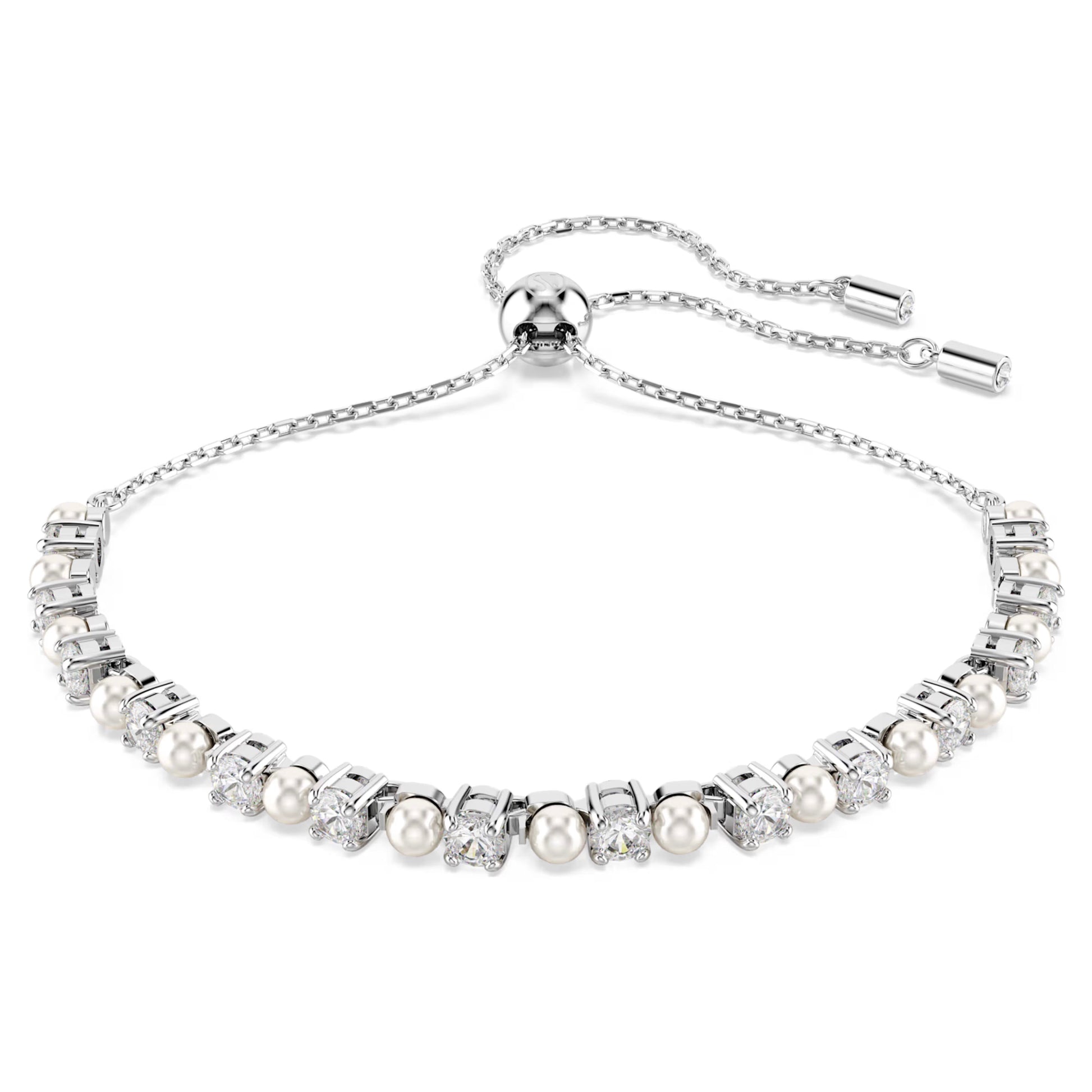 The Swarovski Matrix Bracelet showcases a breathtaking design with lustrous silver elements, embellished with Swarovski Crystal Pearls and dazzling gemstones. This piece features an adjustable chain with a sliding clasp, making it an elegant and refined choice for a sophisticated style.