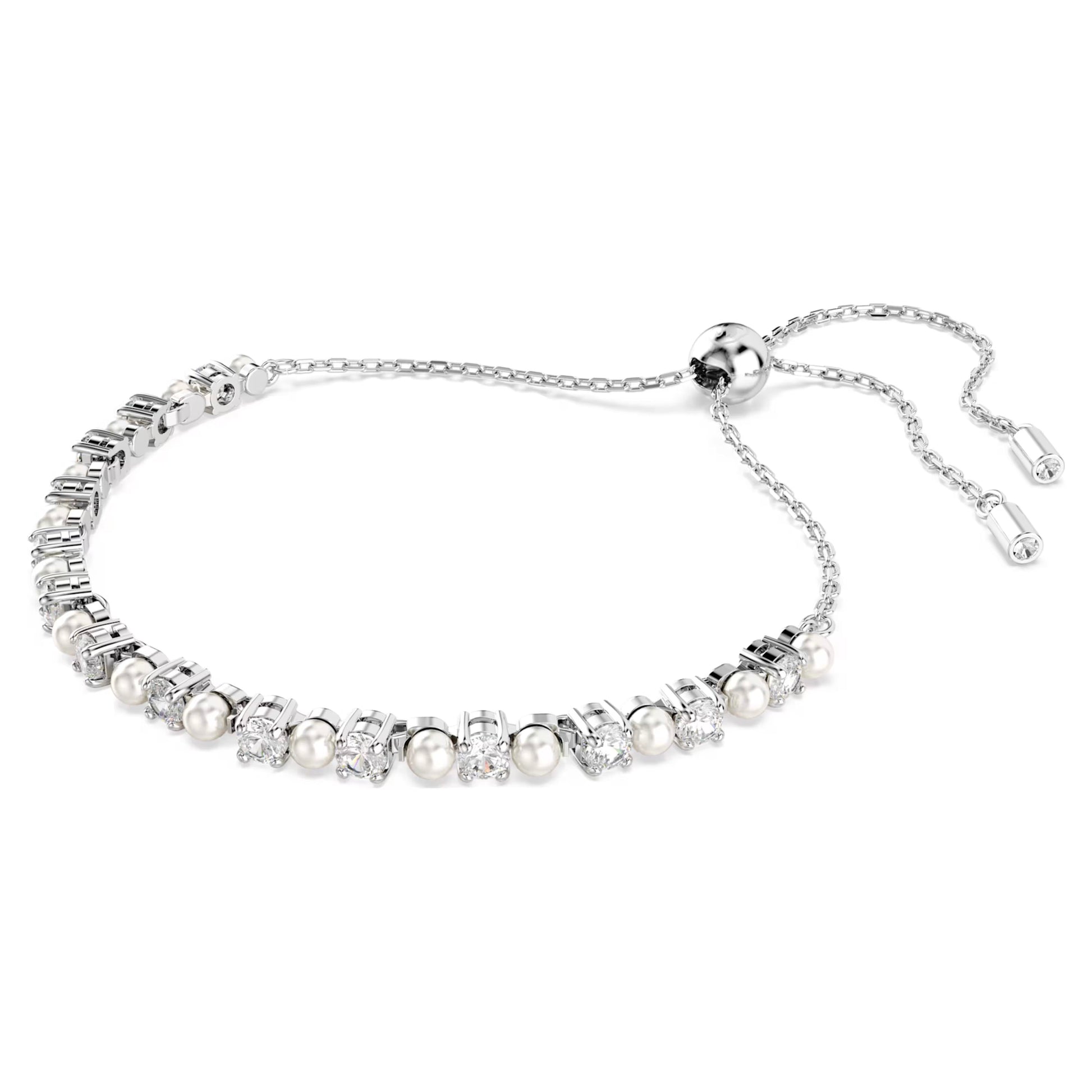 The Swarovski Matrix Bracelet is a silver piece that showcases a stunning combination of Swarovski Crystal Pearls and gemstones. It features a slider clasp for adjustable sizing and is elegantly designed with alternating pearl and gemstone elements set against a polished silver base, making it timeless.