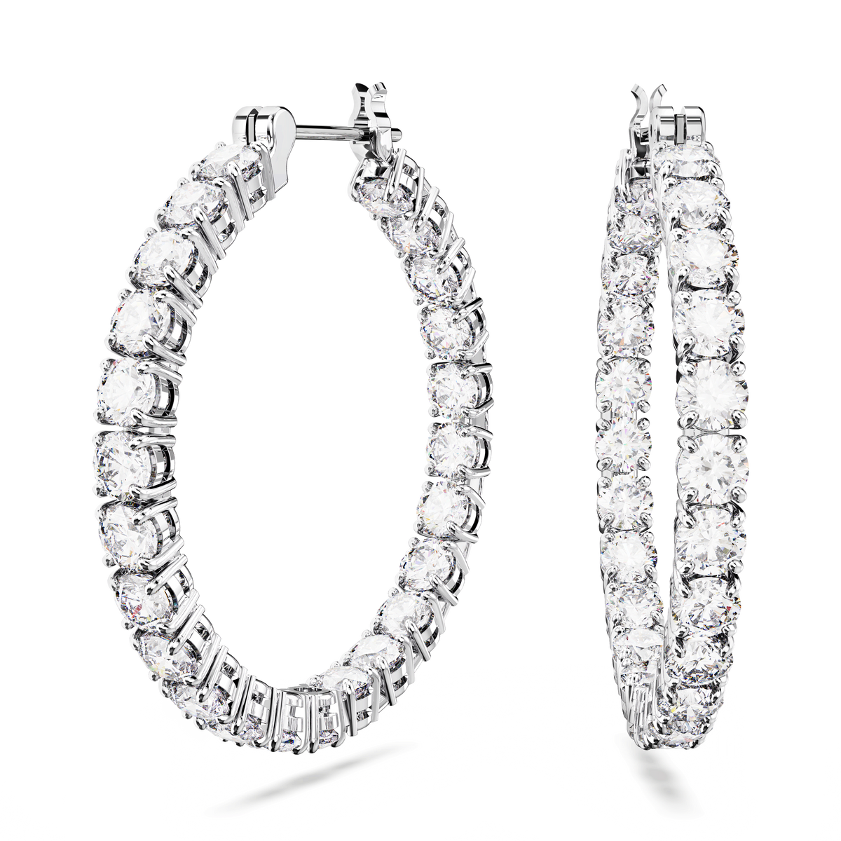 Introducing the Swarovski Matrix hoop earrings, Large, White. Crafted by Swarovski, these rhodium plated hoop earrings showcase two bold silver hoops encrusted with a continuous circle of closely set sparkling clear round-cut stones. The earrings feature a secure clasp and are finished with a high polish for added shine and durability.