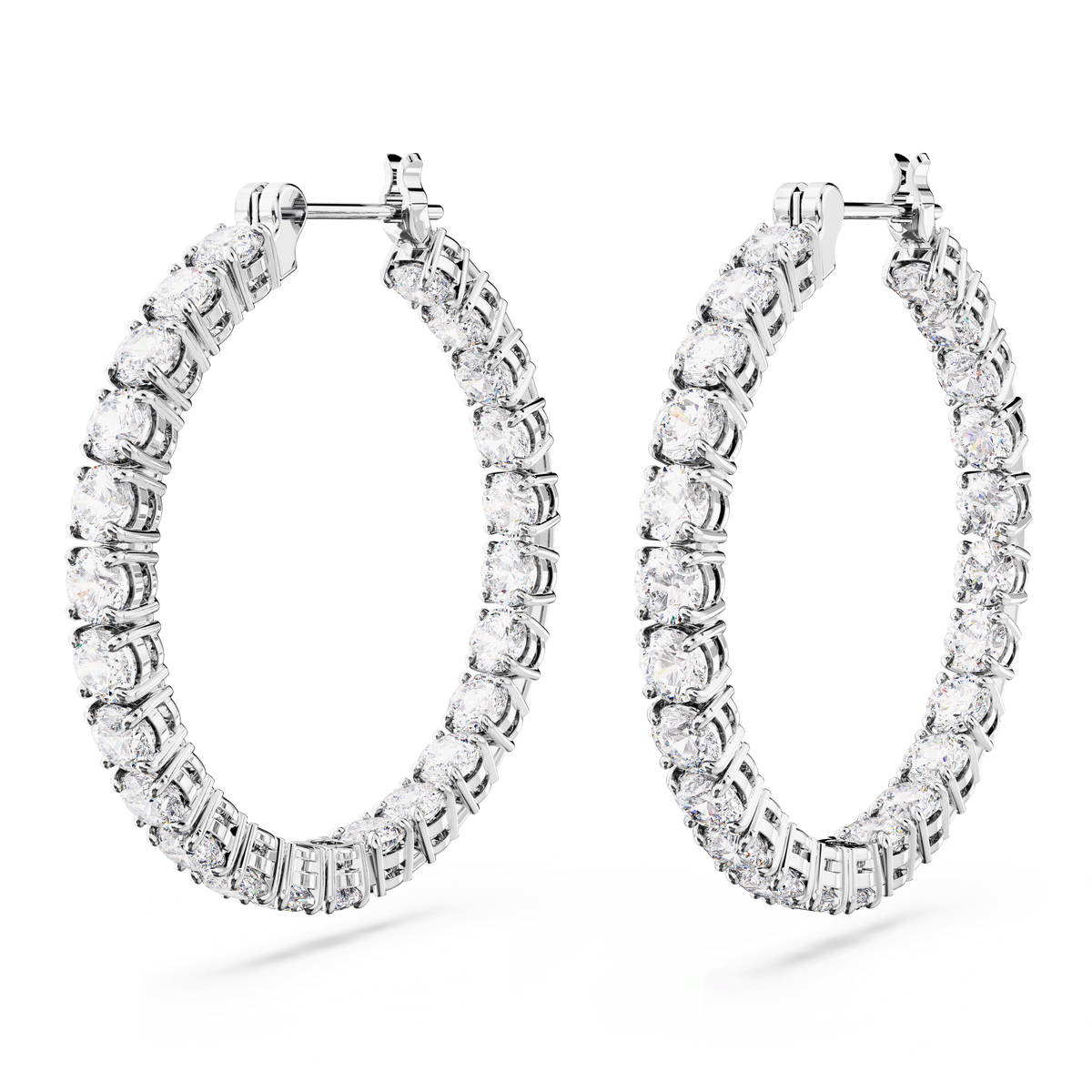 A pair of Swarovski Matrix hoop earrings, large size and rhodium plated, featuring round cut white stones, displayed against a plain white background.