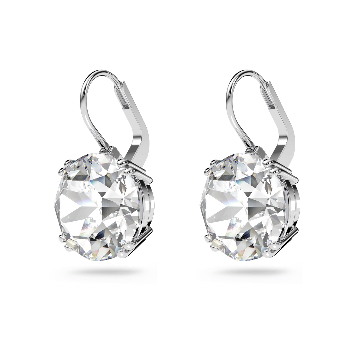 The Swarovski Millenia drop earrings, crafted in rhodium plated metal with lever-back closures, each feature a large, round-cut white crystal securely held in a prong setting and are elegantly displayed on a plain white background.