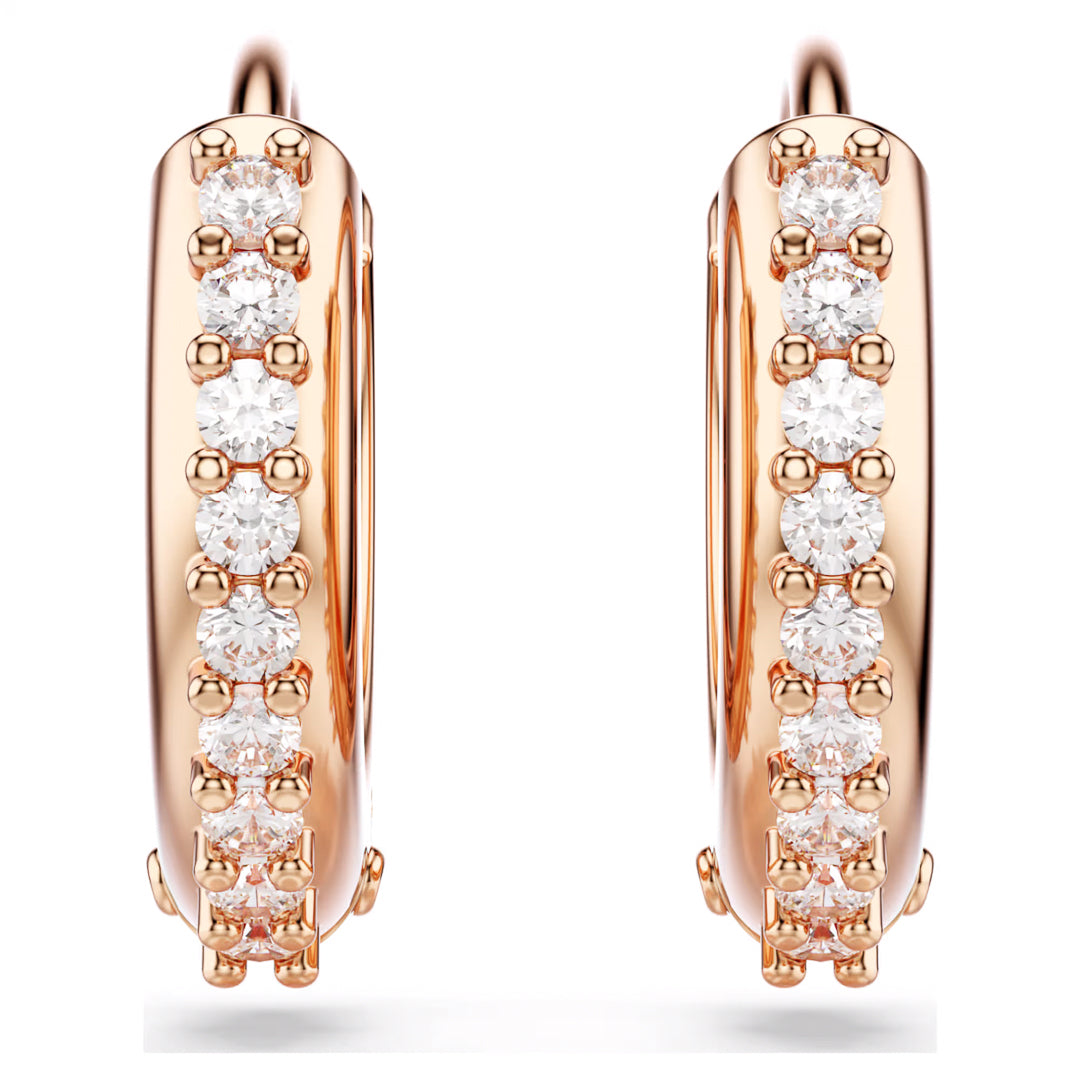Introducing the Swarovski Matrix Hoop Earrings by Swarovski, these sophisticated mini hoops in a chic rose gold-tone are embellished with a row of round, sparkling diamonds along the front. Accentuated with Swarovski Zirconia, these earrings are elegantly presented against a white background to highlight their brilliance and intricate craftsmanship.
