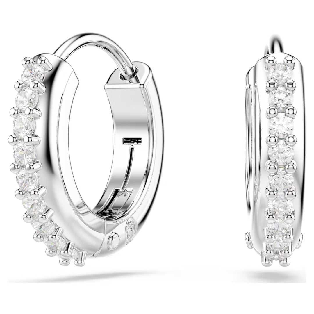 The Swarovski Matrix Hoop Earrings by Swarovski are rhodium-plated mini hoops embellished with small round Swarovski Zirconia along the front. Featuring a hinged closure, these earrings exude a polished and elegant design against a plain white background.