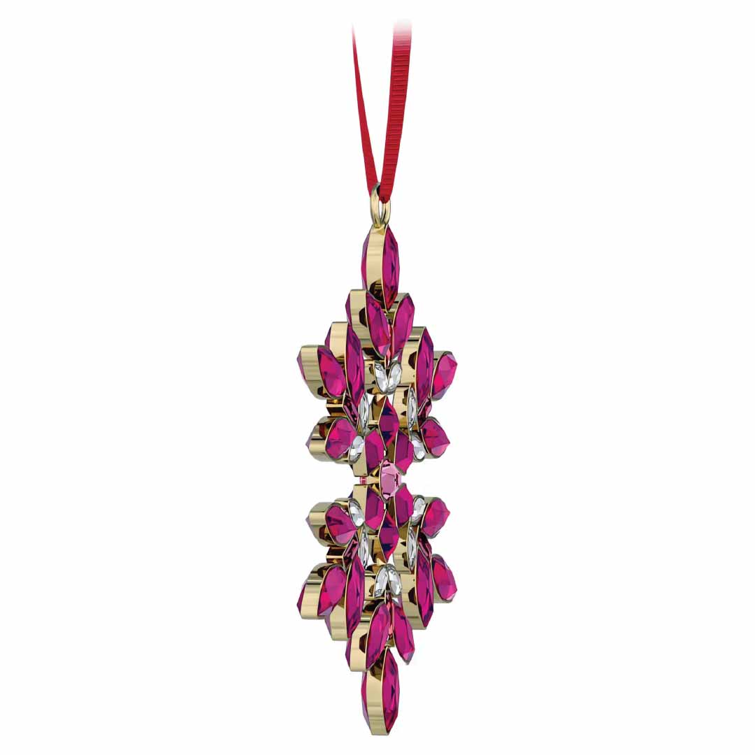 A Swarovski Gema Holiday Ornament Home Décor piece, featuring a shiny gold and pink gemstone floral design, hangs from a red ribbon. Its intricate pattern is adorned with Swarovski crystals arranged symmetrically, offering an elegant and festive look reminiscent of Gema snowflake ornaments.