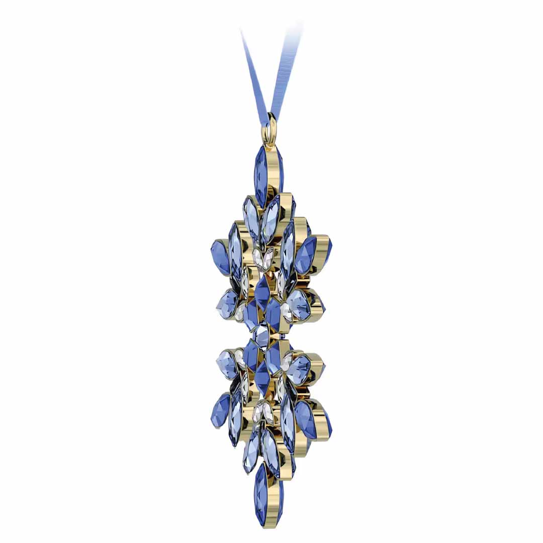 This exquisite Swarovski Gema Holiday Ornament showcases an intricate starburst pattern with blue, faceted gemstones elegantly set in gold-tone metal. The stones are symmetrically arranged to reflect remarkable craftsmanship, evoking the elegance of Swarovski snowflake designs, and it is beautifully suspended by a narrow ribbon.